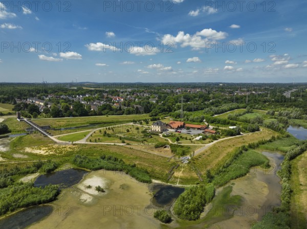 Dortmund, Castrop-Rauxel, North Rhine-Westphalia, Germany - River renaturalisation, renaturation of the Emscher, flood retention basin HRB Mengede. A new floodplain landscape is being created at the Emscher-Auen farm, expanding the area for flood protection during heavy rainfall and for biodiversity. The previously straightened Emscher is being given curves again and can meander through its new floodplain. Following the construction of a parallel sewer, the Emscher has been completely free of sewage since 2022. The river was previously an open, above-ground combined sewer with rainwater and wastewater