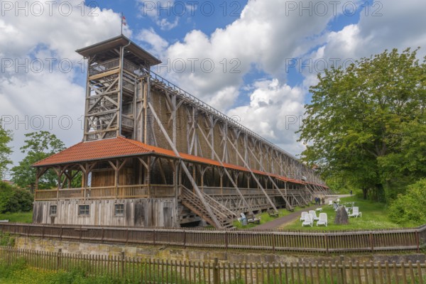 1000 years of salt production in Bad Sooden, Allendorf, Bad Sooden district, town history, historical landmark graduation tower from 1638, wooden construction, 140 metres long, 12 metres high, wooden fence, lawn, trees, open-air inhalatorium, blackthorn, brine air, deckchairs, meadow, trees, aerosols, respiratory tract healing, therapy, white gold, brine, blue sky, clouds, Werra-Meissner district, Hesse, Germany