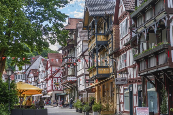 Half-timbered idyll of the old town of Bad Sooden, Allendorf, Bad Sooden district, townscape, restored gabled half-timbered houses with balconies, pedestrian zone for strolling, shops, sunshades, restaurants, Werra-Meissner district, Hesse, Germany