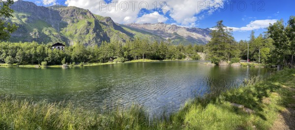 View of small picturesque romantic mountain lake Lago Grande near Moncenisio in Val Cenischia in Graian Alps, Moncenisio, Piedmont, Italy