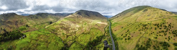 Panorama of Mountains over road A591 from a drone, Grasmere Lake, Grasmere, Ambleside, Lake District, Westmorland, Cumbria, UK