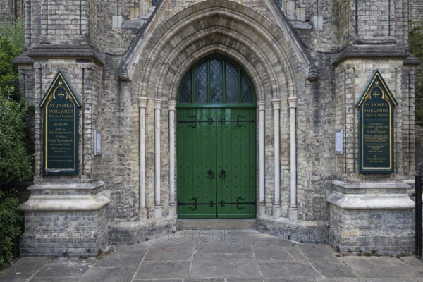 Neo-Gothic church entrance with green door, St James's Church, Norlands, architects Lewis Vulliamy, Robert Jewell Withers, Kensington, London, England, Great Britain