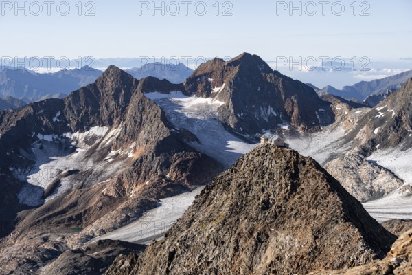 Summit of the Becher with Becherhaus, picturesque high mountain landscape, view of the Übeltalferner glacier and rocky mountain peaks Königshofspitz and Sonklarspitze, Stubai Alps, South Tyrol, Italy