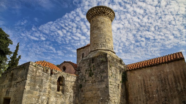 Imposing stone tower against a blue sky with characteristic architecture, Rhodes Old Town, Rhodes, Dodecanese, Greek Islands, Greece
