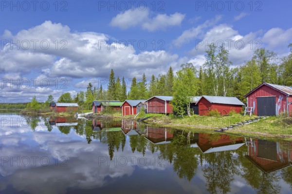Traditional red wooden boat houses, boathouses at Lake Ånnsjön, Jämtland County, western Sweden, Scandinavia