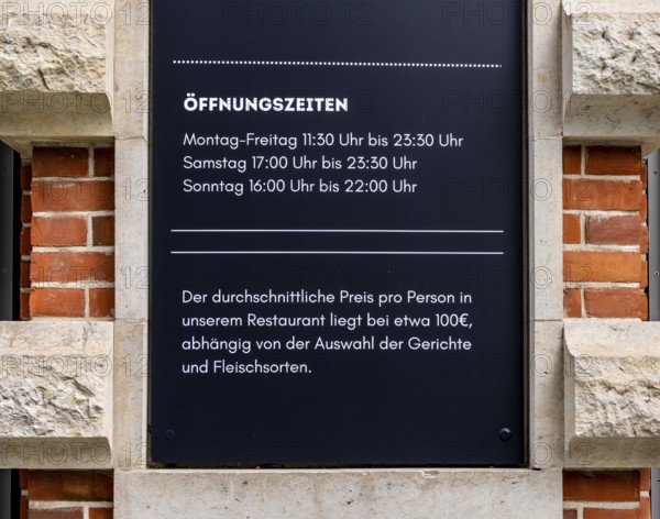 Sign at the entrance to a restaurant on Hausvogteiplatz, Berlin, Germany