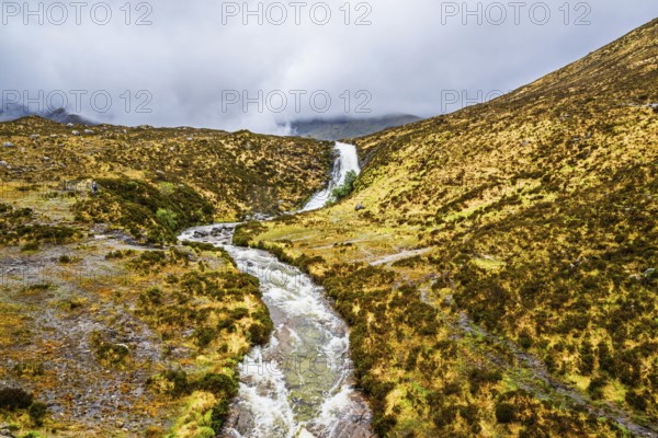 Eas a' Bhradain waterfall, Red Cuillin mountains, Loch Ainort, Isle of Skye, Scotland, UK