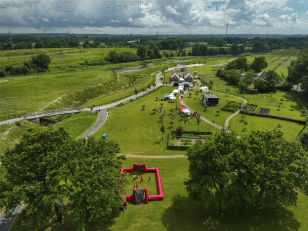 Recklinghausen, Castrop-Rauxel, Ruhr area, North Rhine-Westphalia, Germany - Sports festival in the EMSCHERLAND adventure park, a new nature and water adventure park on the renaturalised Emscher, at the water cross of the Emscher with the Rhine-Herne Canal on the city boundary of Recklinghausen and Castrop-Rauxel. Flood protection by expanding the area. The ecological focus at the confluence of the Suderwicher Bach and Emscher will also become a future garden for the International Garden Exhibition IGA 2027. Before the renaturalisation, the Emscher river system was an open, above-ground wastewater channel, combined sewer with surface water and wastewater