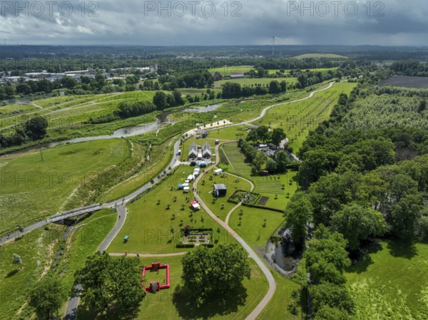 Recklinghausen, Castrop-Rauxel, Ruhr area, North Rhine-Westphalia, Germany - Sports festival in the EMSCHERLAND adventure park, a new nature and water adventure park on the renaturalised Emscher, at the water cross of the Emscher with the Rhine-Herne Canal on the city boundary of Recklinghausen and Castrop-Rauxel. Flood protection by expanding the area. The ecological focus at the confluence of the Suderwicher Bach and Emscher will also become a future garden for the International Garden Exhibition IGA 2027. Before the renaturalisation, the Emscher river system was an open, above-ground wastewater channel, combined sewer with surface water and wastewater