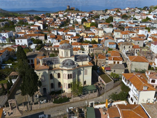 Historic church with dome in an old town full of narrow streets and red roofs, aerial view, Alibey, Alibey Adasi Island, Ayvalik, Turkey