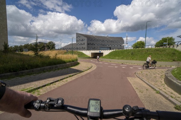 Roundabout in the Dutch city of Houten, the lanes for cars and bicycles are separated, the cycle path runs under the car lane, through subways, so that cyclists and cars can pass the intersection separately, in Houten, bicycle traffic has priority, considered a model city for modern bicycle traffic, Netherlands