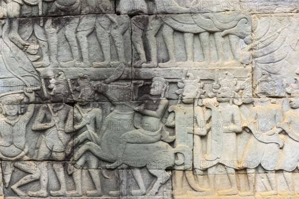 Stone bas-reliefs, Khmer war campaign against the Cham, relief wall, east façade, Bayon temple, Angkor Thom, Siem Reap province, Cambodia