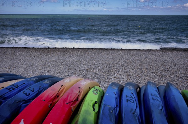 Kayaks, boats, colourful, lying on the beach, pebble beach, Étretat, sea, Normandy, Seine-Maritime, France