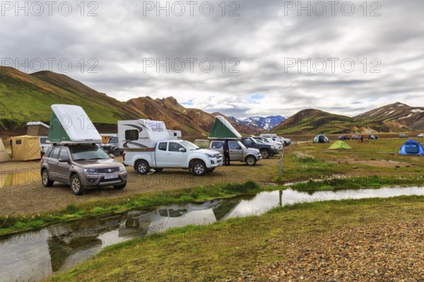 Off-road vehicle with roof tent, camping site in Landmannalaugar, Icelandic highlands, rain clouds, Suðurland, Sudurland, Iceland