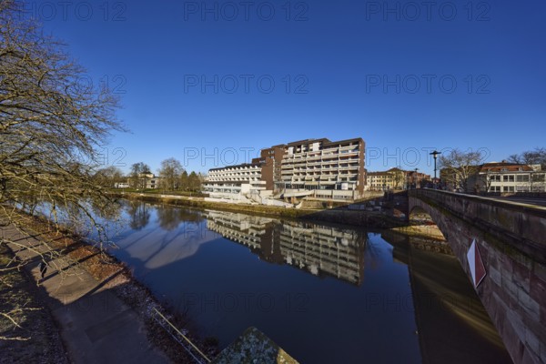 Langwied Foundation, nursing home, modern architecture, concrete architecture, Saar River, symmetrical reflections, water surface, riverbank, car and pedestrian bridge, footpath and cycle path, lantern, blue sky, cloudless, Bismarck Bridge, Saarbrücken, state capital, Saarbrücken Regional Association, Saarland, Germany