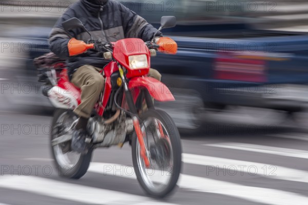 Man riding a motorcycle, Riding at high speed, Photo with motion blur, City of Quito, Pichincha province, Ecuador, South America