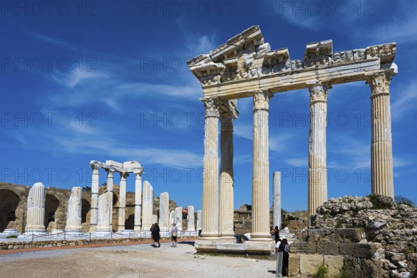 Ruined temple with majestic columns under a clear sky. Historical atmosphere in ancient Greek style, Temple of Apollo, Side, Manavgat, Antalya province, Turkey