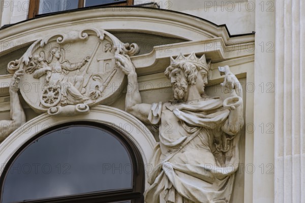 Jupiter and Janus holding a relief of Fortuna, sculptural relief on the façade of St Michael's Wing in the inner courtyard of the Vienna Hofburg Imperial Palace, Vienna, Austria, for editorial use only