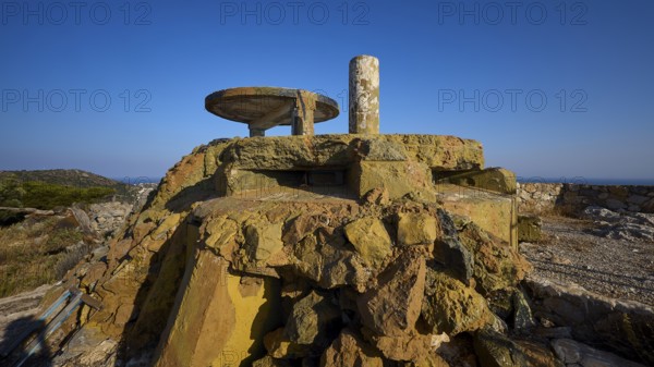 Dilapidated concrete structure on rocky ground with unobstructed view under a blue sky, Lost Place, Lago anti-aircraft battery, bunker, Apitiki Mountain, Leros, Dodecanese, Greek Islands, Greece