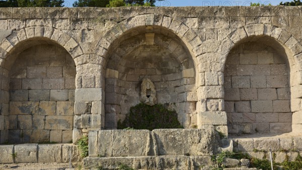 Three vaulted niches in an old stone wall in a historical site, retaining wall with niche, relief of the shepherd god Pan, Asklipion, Asklepieion, healing temple, temple, Hippocrates, Kos, Dodecanese, Greek Islands, Greece