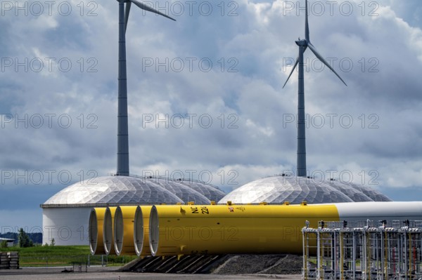 The seaport of Eemshaven, Julianahaven Basin, where the foundation structures, monopiles, for offshore wind farms are stored, which then support the actual wind turbines, the components are transported to the wind farms in the North Sea on large workboats and anchored to the seabed, where the wind turbines are then built, Eemshaven, Netherlands
