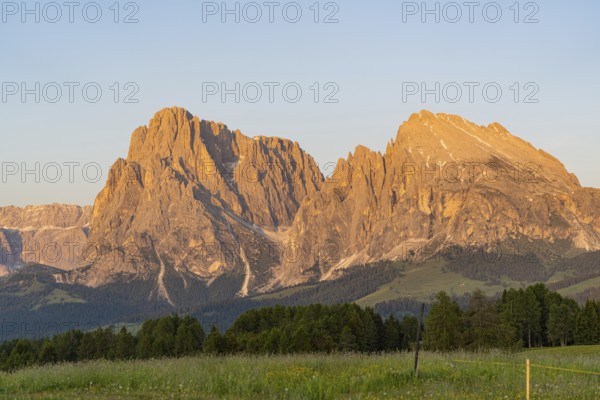 Majestic mountain peaks of the Dolomites, illuminated by the evening sun, Alpe di Siusi, Dolomites, South Tyrol, Italy