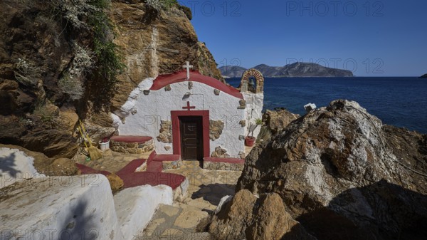 Legend, crab, shell fisherman, Mediterranean chapel with red roof on the rocky coast overlooking the sea, peaceful atmosphere, chapel, little church, Agia Kavouradena monastery, Xirokambos, Leros, Dodecanese, Greek Islands, Greece