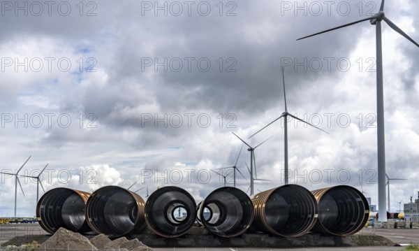 The seaport of Eemshaven, Julianahaven Basin, where the foundation structures, monopiles, for offshore wind farms are stored, which then support the actual wind turbines, the components are transported to the wind farms in the North Sea on large workboats and anchored to the seabed, where the wind turbines are then built, Eemshaven, Netherlands