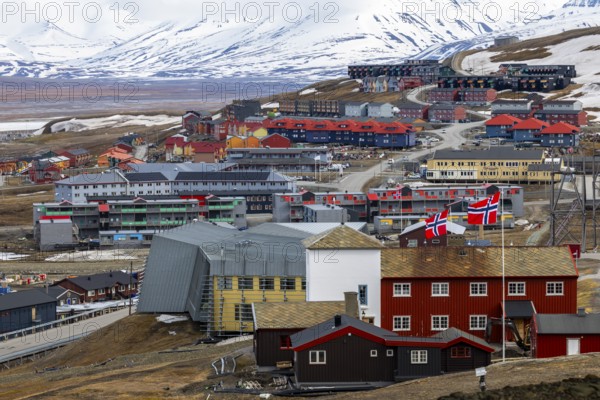 View of Longyearbyen, coloured wooden houses, mountain range, Spitsbergen, Svalbard