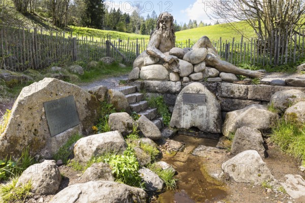Figure of the river god Danuvius by sculptor Wolfgang Eckert at the source of the Breg, source of the Danube in Furtwangen in the Black Forest, Baden-Württemberg, Germany