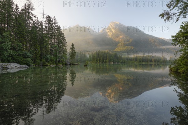 Magical sunrise with fog at Hintersee near Ramsau in Berchtesgadener Land