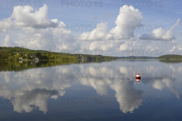 View over the Möhnesee, Möhnesee tower, red and white buoy, blue cloudy sky, reflection on the water surface, Möhnetalsperre, North Rhine-Westphalia, Germany