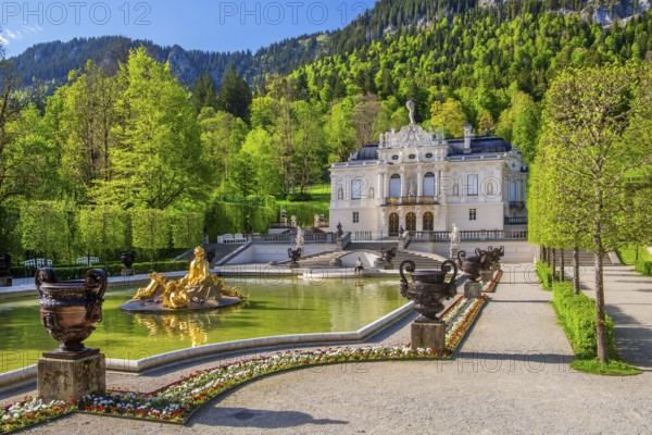 Water parterre with flora fountain and the portal of Linderhof Castle in spring, municipality of Ettal, Ammergau Alps, Ammertal, Upper Bavaria, Bavaria, Germany