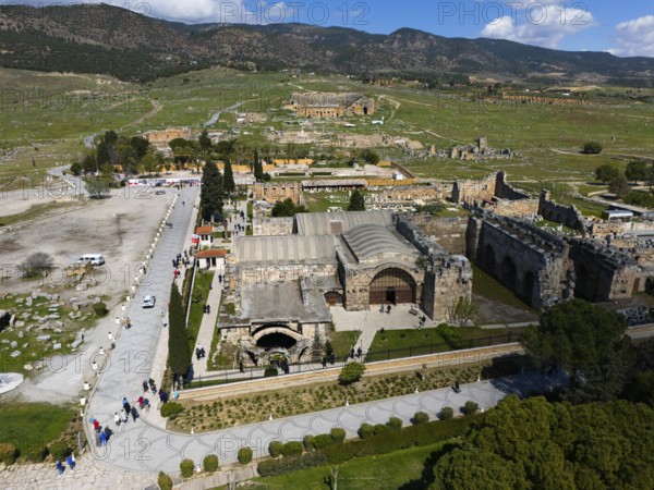 Historic stone architecture from above with surrounding landscape and tourists, Aerial view, Ancient site of Hierapolis, Pamukkale, Denizli, Anatolia, Turkey