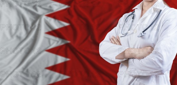 Doctor with crossed arms on Bahrain flag. Bahrain health and care concept. Female doctor on Bahrain flag