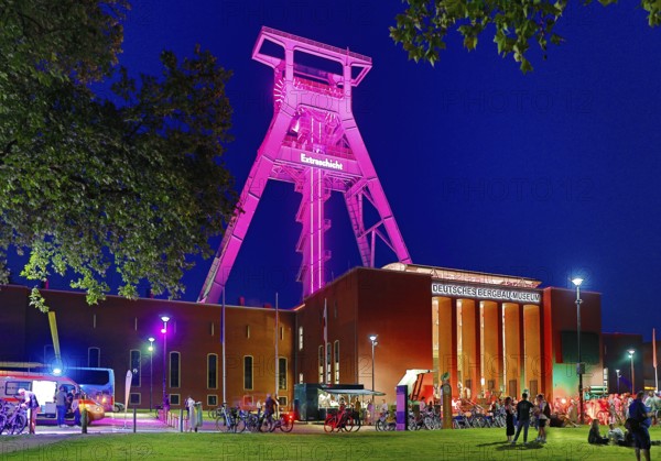 People in front of the German Mining Museum for the Extra Shift at night, Bochum, Ruhr Area, North Rhine-Westphalia, Germany