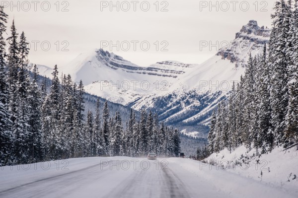 Winter road trip on the Icefields Parkway with lots of snow and ice, Banff National Park, Jasper National Park, Alberta, Canada