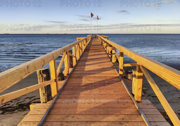 New south beach bridge at atmospheric sunrise with a view of Amrum, Südstrand, Wyk auf Föhr, North Frisia, Germany