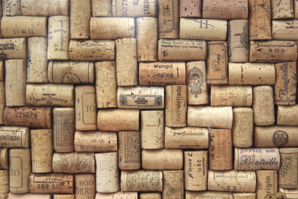 Corks from wine bottles laid as a regular pattern, wine corks, red wine