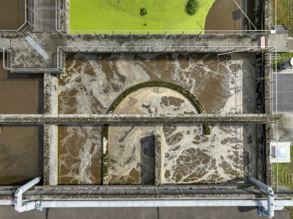 Germany - Wastewater treatment in a sewage treatment plant, clarifier with brown wastewater (symbolic photo) . The first purification stage of a sewage treatment plant comprises mechanical purification (removal of coarse solids, sand, fats), the second stage the biological process (removal of nutrients by means of micro-organisms), the third stage is known as chemical-physical treatment (phosphate precipitation) . In future, a fourth treatment stage will be necessary to remove trace substances, microplastics and medicines