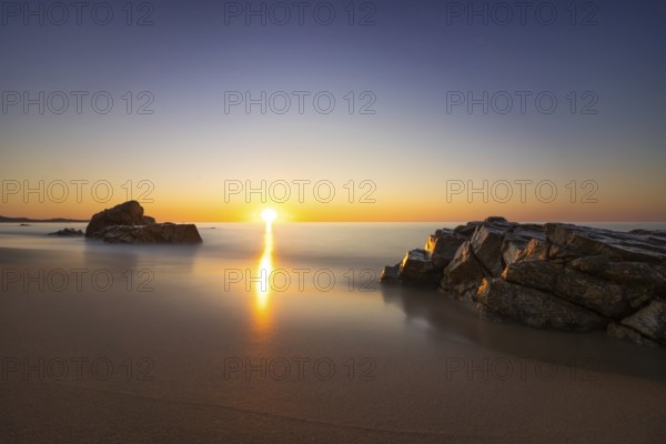 The sun rises on the Costa Rei, a stretch of coastline on the Italian Mediterranean island of Sardinia, Monte Nai, Costa Rei, Sardinia, Italy