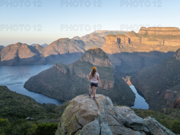 Hiker enjoying panorama, Blyde River Canyon with summit Three Rondawels, view of canyon with river Blyde River and table mountains, canyon landscape, Panorama Route, Mpumalanga, South Africa
