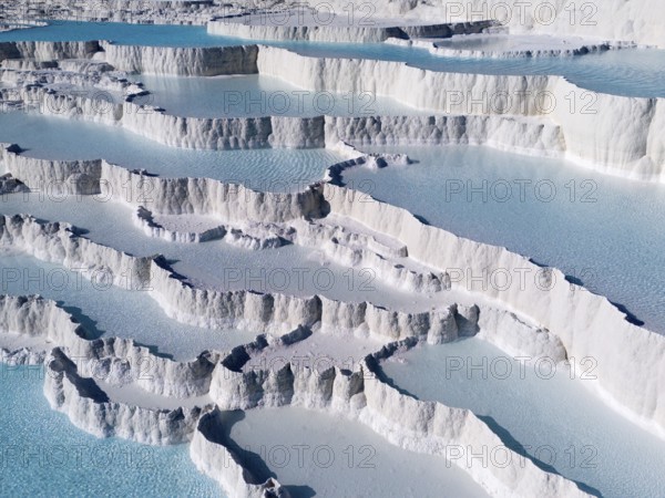 White limestone terraces with turquoise-coloured water under a clear sky, aerial view, sinter terraces, limestone sinter terraces, travertine terraces, Pamukkale, Denizli, UNESCO World Heritage Site, Anatolia, Turkey