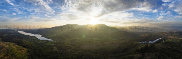 Panorama of Sunset over Mountains and Coniston Water from drone, Lake District National Park, Cumbria, England, United Kingdom