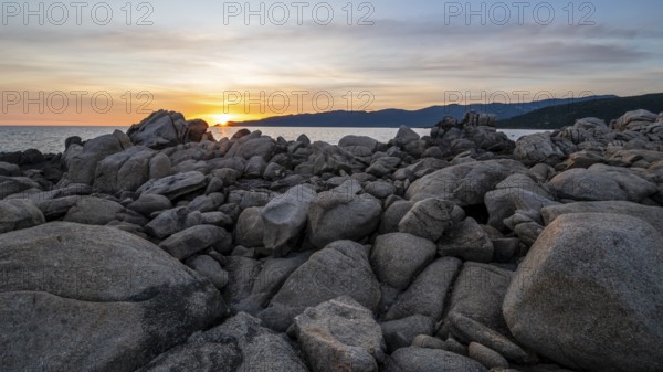Sunset, rocky coast near Porto Pollo, Corsica, France