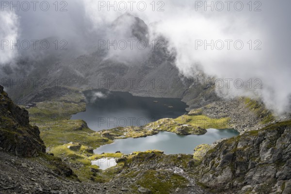 Mountain lakes Wangenitzsee and Kreuzsee, cloudy mountain peaks in the morning, Schober group, Hohe Tauern National Park, Carinthia, Austria