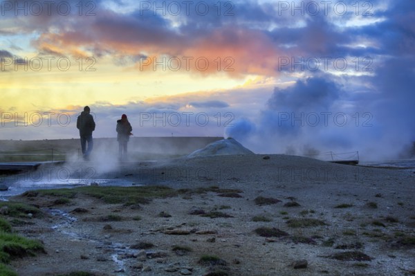 Walkers, sulphur vapour, fumarole, solfataras in the Hveravellir geothermal area, sunset, Icelandic highlands, Suðurland, Sudurland, Iceland