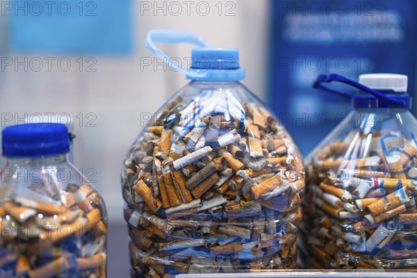 Plastic bottles filled with cigarette butts highlighting environmental pollution and the need for proper disposal