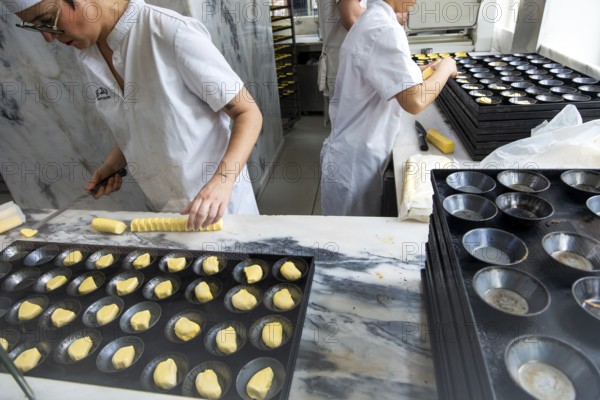 Making Pastel de Nata cakes, Manteigaria coffee house cafe, Bolhao, city of Porto, Portugal