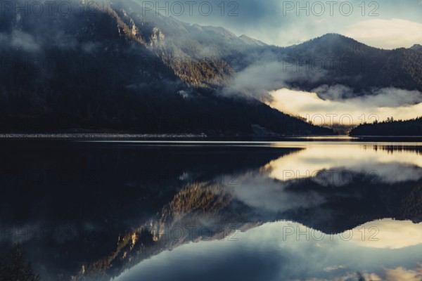 Sunrise with reflections in the Plansee in Tyrol in the Alps in Austria